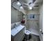 Compact bathroom with a stand-up shower, bright mirror, and vanity at 6166 9Th N Ave, St Petersburg, FL 33710