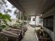 The exterior features a covered walkway with gardening plots and a view of the backyard at 6166 9Th N Ave, St Petersburg, FL 33710