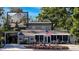 Charming single Gathering home with covered parking, well-manicured lawn and an American flag at 6166 9Th N Ave, St Petersburg, FL 33710
