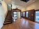 Open living room featuring wood floors, staircase, and doors to the outdoor area at 6166 9Th N Ave, St Petersburg, FL 33710
