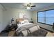 Inviting bedroom featuring a comfortable bed, stylish decor, and natural light from a large window at 6166 9Th N Ave, St Petersburg, FL 33710