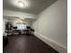 An unfurnished room with dark floors, a ceiling fan, and a window accent at 6166 9Th N Ave, St Petersburg, FL 33710