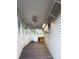 This sunroom features multiple windows, light fixtures, and shelving for storage at 6166 9Th N Ave, St Petersburg, FL 33710