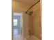 Clean bathroom featuring a tiled shower and tub combo perfect for relaxation and efficient cleaning at 625 Mirabay Blvd, Apollo Beach, FL 33572
