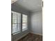 Bright bedroom with neutral paint, and wood-look tile flooring at 625 Mirabay Blvd, Apollo Beach, FL 33572