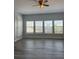 Bedroom with hardwood floors, natural light, and neutral walls creating a serene space at 625 Mirabay Blvd, Apollo Beach, FL 33572