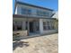 Exterior of home with neutral paint, paved patio, and covered porch at 625 Mirabay Blvd, Apollo Beach, FL 33572