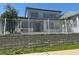Well-maintained home featuring a white fence and lush landscaping in a desirable neighborhood at 625 Mirabay Blvd, Apollo Beach, FL 33572