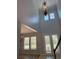 Grand foyer with soaring ceilings, decorative chandelier, and double door entry at 625 Mirabay Blvd, Apollo Beach, FL 33572