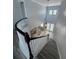Grand foyer with dark wood staircase and view of the living room below at 625 Mirabay Blvd, Apollo Beach, FL 33572