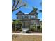 Attractive two-story home with a metal roof, mature landscaping, and a welcoming front porch at 625 Mirabay Blvd, Apollo Beach, FL 33572