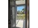 Charming front porch with white railing offering views of lush landscaping and street at 625 Mirabay Blvd, Apollo Beach, FL 33572