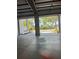 View from garage looking out to tropical landscaping and neighborhood at 625 Mirabay Blvd, Apollo Beach, FL 33572