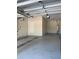 Spacious garage featuring a door and water heater at 625 Mirabay Blvd, Apollo Beach, FL 33572