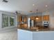 Open-concept kitchen with granite counters, stainless steel appliances, and custom cabinets at 625 Mirabay Blvd, Apollo Beach, FL 33572