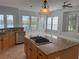 Spacious kitchen boasts granite countertops, a gas cooktop island, and stainless steel appliances at 625 Mirabay Blvd, Apollo Beach, FL 33572