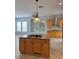 Spacious kitchen island with gas cooktop and granite countertops at 625 Mirabay Blvd, Apollo Beach, FL 33572