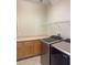 Convenient laundry area equipped with a counter, cabinets, shelving, and Samsung washer and dryer at 625 Mirabay Blvd, Apollo Beach, FL 33572