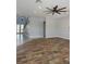 Open living room with wood-look floors, recessed lighting, and ceiling fan at 625 Mirabay Blvd, Apollo Beach, FL 33572