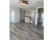Open living room featuring hardwood floors, staircase, and neutral paint scheme at 625 Mirabay Blvd, Apollo Beach, FL 33572