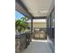 Outdoor kitchen with granite countertops, stainless steel grill, and mini-fridge at 625 Mirabay Blvd, Apollo Beach, FL 33572