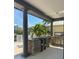 Outdoor kitchen featuring a built-in grill, countertop space, and access to tropical backyard at 625 Mirabay Blvd, Apollo Beach, FL 33572