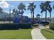 Colorful playground with slides and climbing structures surrounded by lush greenery for a fun and active community space at 625 Mirabay Blvd, Apollo Beach, FL 33572