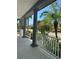 Inviting porch with columns and view of landscaped street with palm trees at 625 Mirabay Blvd, Apollo Beach, FL 33572