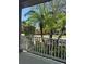 Cozy porch view with white railing overlooking lush tropical landscaping at 625 Mirabay Blvd, Apollo Beach, FL 33572