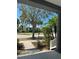 Serene porch view featuring lush landscaping and neighborhood street at 625 Mirabay Blvd, Apollo Beach, FL 33572