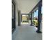 Expansive porch with stylish columns offering neighborhood views at 625 Mirabay Blvd, Apollo Beach, FL 33572