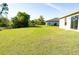 Expansive backyard with lush lawn, perfect for outdoor activities and relaxation at 6422 Towhlen Rd, North Port, FL 34291