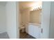 Bright bathroom featuring a double sink vanity with granite counters and a shower-tub combo at 6422 Towhlen Rd, North Port, FL 34291