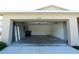 Spacious two-car garage with plenty of room for storage and an included access door at 6422 Towhlen Rd, North Port, FL 34291