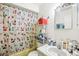 This bathroom has a shower with patterned curtains and a sink area at 7210 N Manhattan Ave # 1721, Tampa, FL 33614
