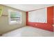 A bedroom with two paint colors and a window for natural light at 7210 N Manhattan Ave # 1721, Tampa, FL 33614