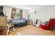 Bedroom featuring wood floors, natural light, and comfortable furnishings at 7210 N Manhattan Ave # 1721, Tampa, FL 33614