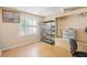 A bedroom with a metal shelf, small closet, and a window for natural light at 7210 N Manhattan Ave # 1721, Tampa, FL 33614