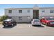 A two-story condo building with visitor parking and a tidy exterior at 7210 N Manhattan Ave # 1721, Tampa, FL 33614