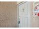 The front door of unit 1721 features a door knocker and key in the lock at 7210 N Manhattan Ave # 1721, Tampa, FL 33614