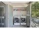 Outdoor laundry area with included washer and dryer units and extra storage at 7210 N Manhattan Ave # 1721, Tampa, FL 33614