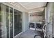 An outdoor laundry area features a washer, dryer, and sliding glass doors at 7210 N Manhattan Ave # 1721, Tampa, FL 33614