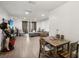 The living room and dining area have wood-look floors and modern lighting at 7210 N Manhattan Ave # 1721, Tampa, FL 33614