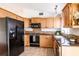 Well-equipped kitchen with ample cabinet space, granite countertops and modern appliances at 7934 Aden Loop, New Port Richey, FL 34655