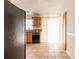 Bright kitchen with tiled floors, modern cabinets, stainless steel appliances, and natural light at 7934 Aden Loop, New Port Richey, FL 34655