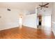 Open-concept living space with hardwood floors connecting to the kitchen at 7934 Aden Loop, New Port Richey, FL 34655