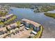 Overhead view of waterfront condos featuring boat slips, community amenities, and beautiful landscaping at 8150 Brent St # 725, Port Richey, FL 34668
