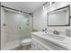 Modern bathroom featuring a glass shower, white marble, and a toilet at 8150 Brent St # 725, Port Richey, FL 34668