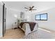 Inviting bedroom with a ceiling fan, wood floors, large window and neutral décor at 8150 Brent St # 725, Port Richey, FL 34668