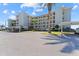 Low rise condominium building with covered parking and beautiful, mature landscaping at 8150 Brent St # 725, Port Richey, FL 34668